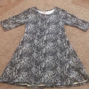 A snake type printed kids dress.